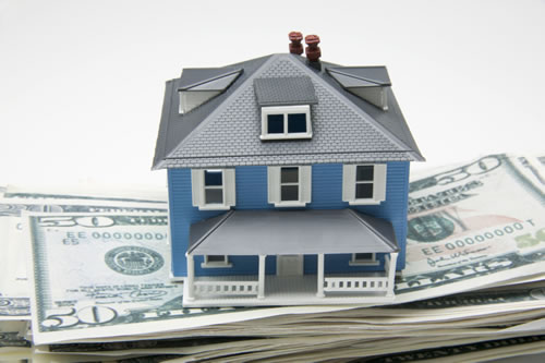 Small Home on Stack of Money - Charlotte Real Estate